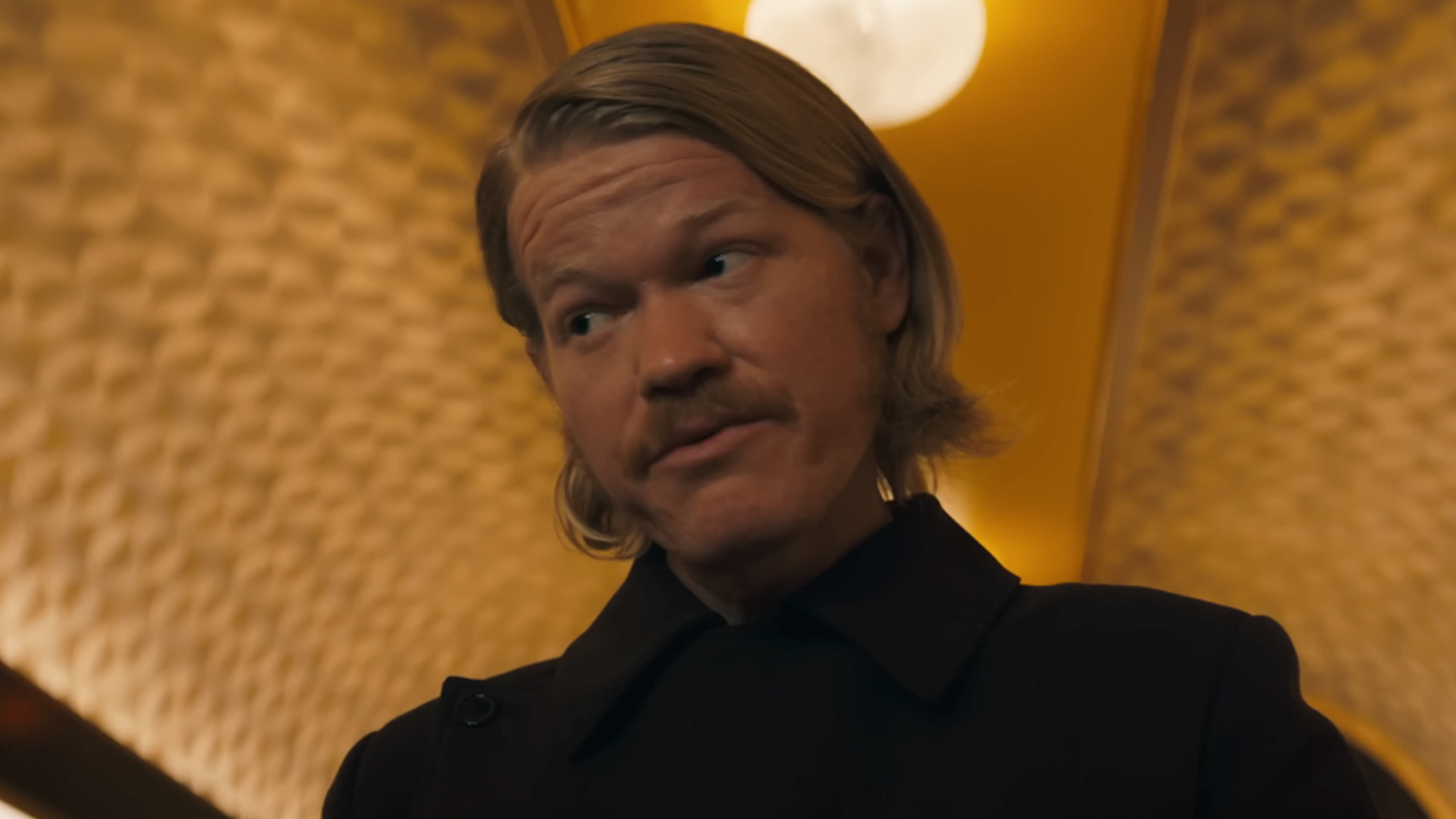 Jesse Plemons with long hair and a mustache in Sunrise on the Reaping