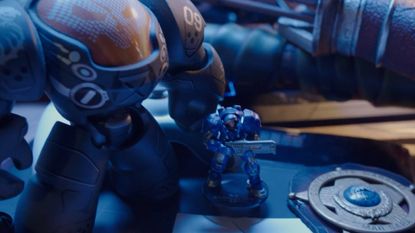 A few StarCraft collectables stand on a desk