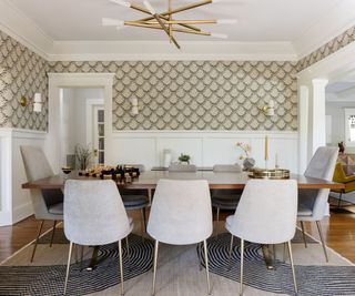 dining room with white chairs and trellis wallpaper