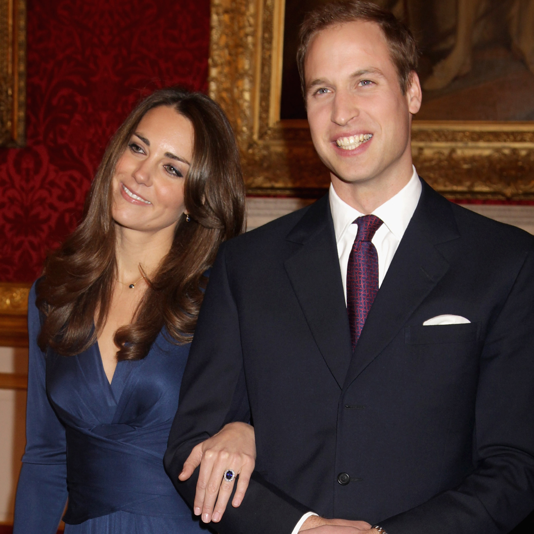 Princess Kate wears a navy blue satin dress as she announces her engagement to Prince William, who wears a suit