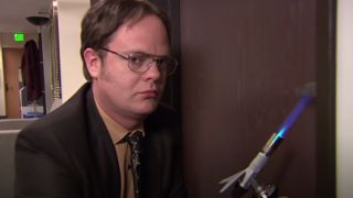 Dwight uses a blowtorch on the door handles to simulate a fire