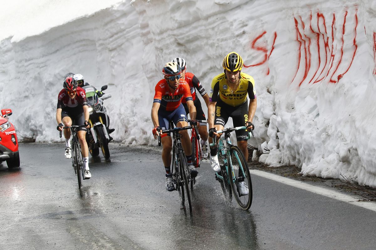 Vincenzo Nibali rides aside Primoz Roglic on the final climb