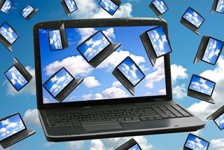 laptop containing images of itself repeated on the screen and in the cloudy sky background