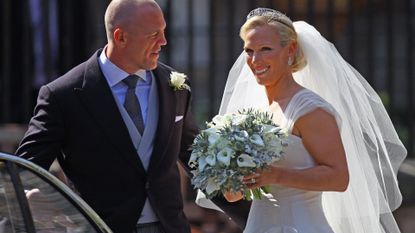 Mike Tindall and Zara Phillips depart after their Royal wedding at Canongate Kirk on July 30, 2011 in Edinburgh, Scotland. The Queen's granddaughter Zara Phillips will marry England rugby player Mike Tindall today at Canongate Kirk. Many royals are expected to attend including the Duke and Duchess of Cambridge.