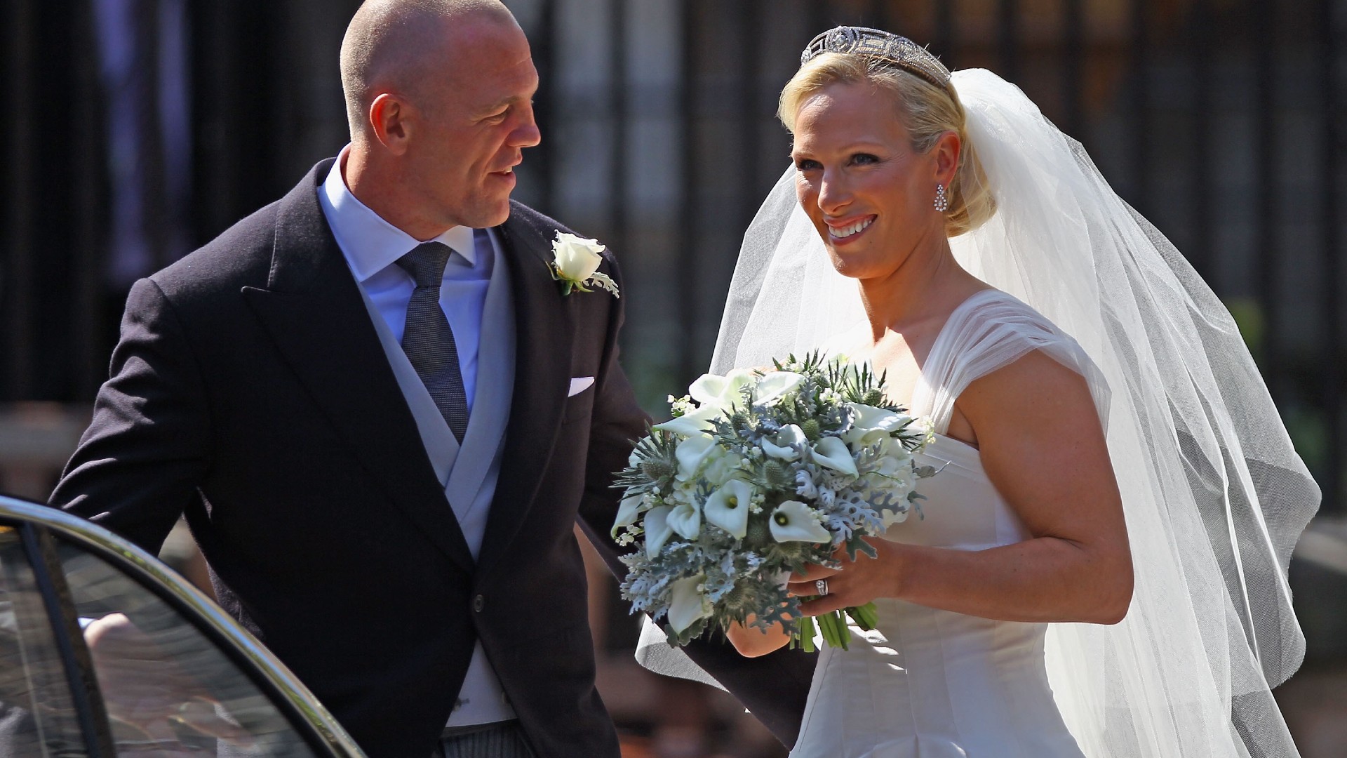 Mike Tindall and Zara Phillips depart after their Royal wedding at Canongate Kirk on July 30, 2011 in Edinburgh, Scotland. The Queen&#039;s granddaughter Zara Phillips will marry England rugby player Mike Tindall today at Canongate Kirk. Many royals are expected to attend including the Duke and Duchess of Cambridge.
