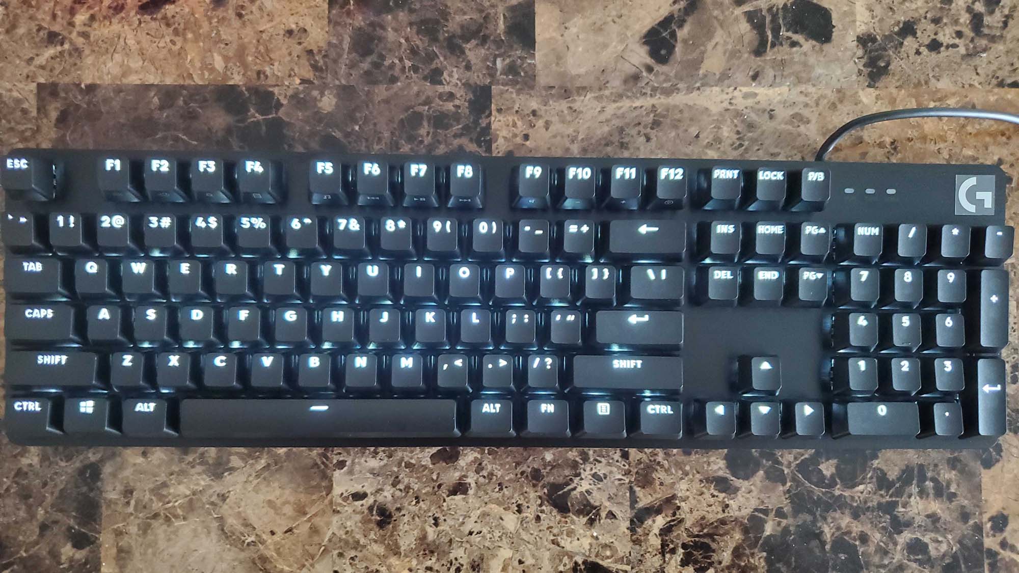 A Logitech G413 on a counter top