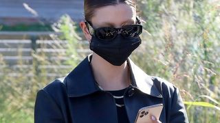 Hailey Bieber wearing a face mask and sunglasses