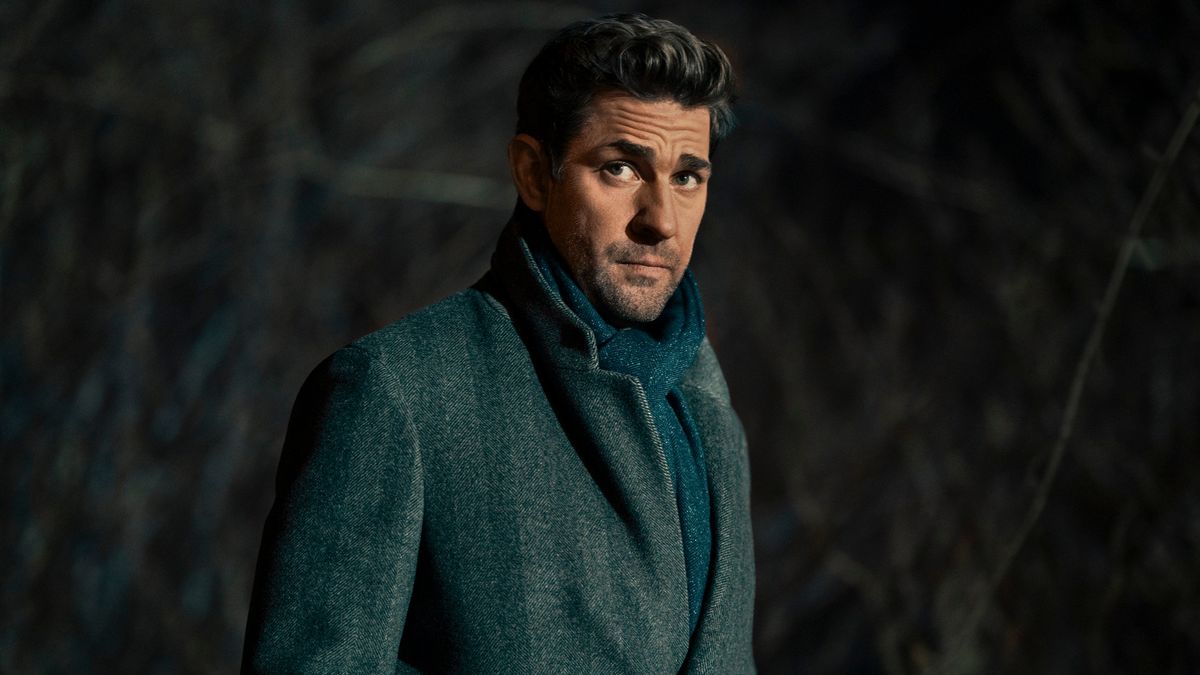 John Krasinski as Jack Ryan wearing a grey coat and blue scarf in Tom Clancy&#039;s Jack Ryan.