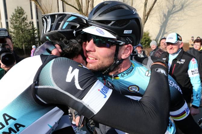 Stage 2 winner Mark Cavendish is congratulated by Omega Pharma-QuickStep teammate Gert Steegmans.