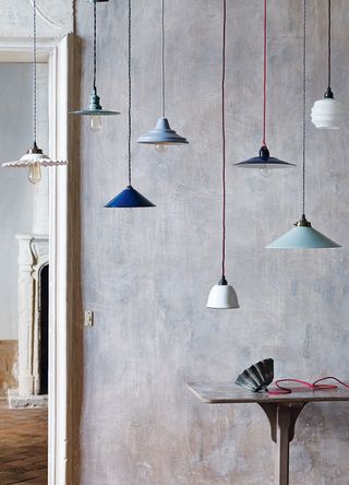 plastered hallway with selection of pendant lights hanging