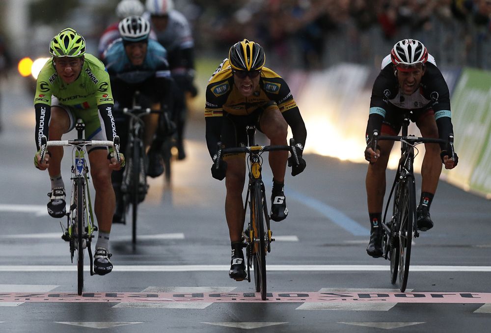 Gerald Ciolek (yellow) crosses the finish line to win the 104th Milan-San Remo