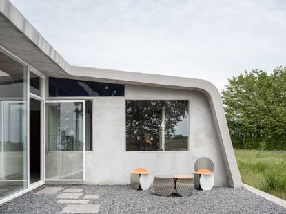 Metal garden furniture on a gravel and paving slab patio