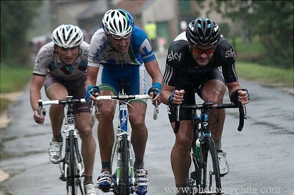 Greg Henderson (Sky) leads a group through the downpour