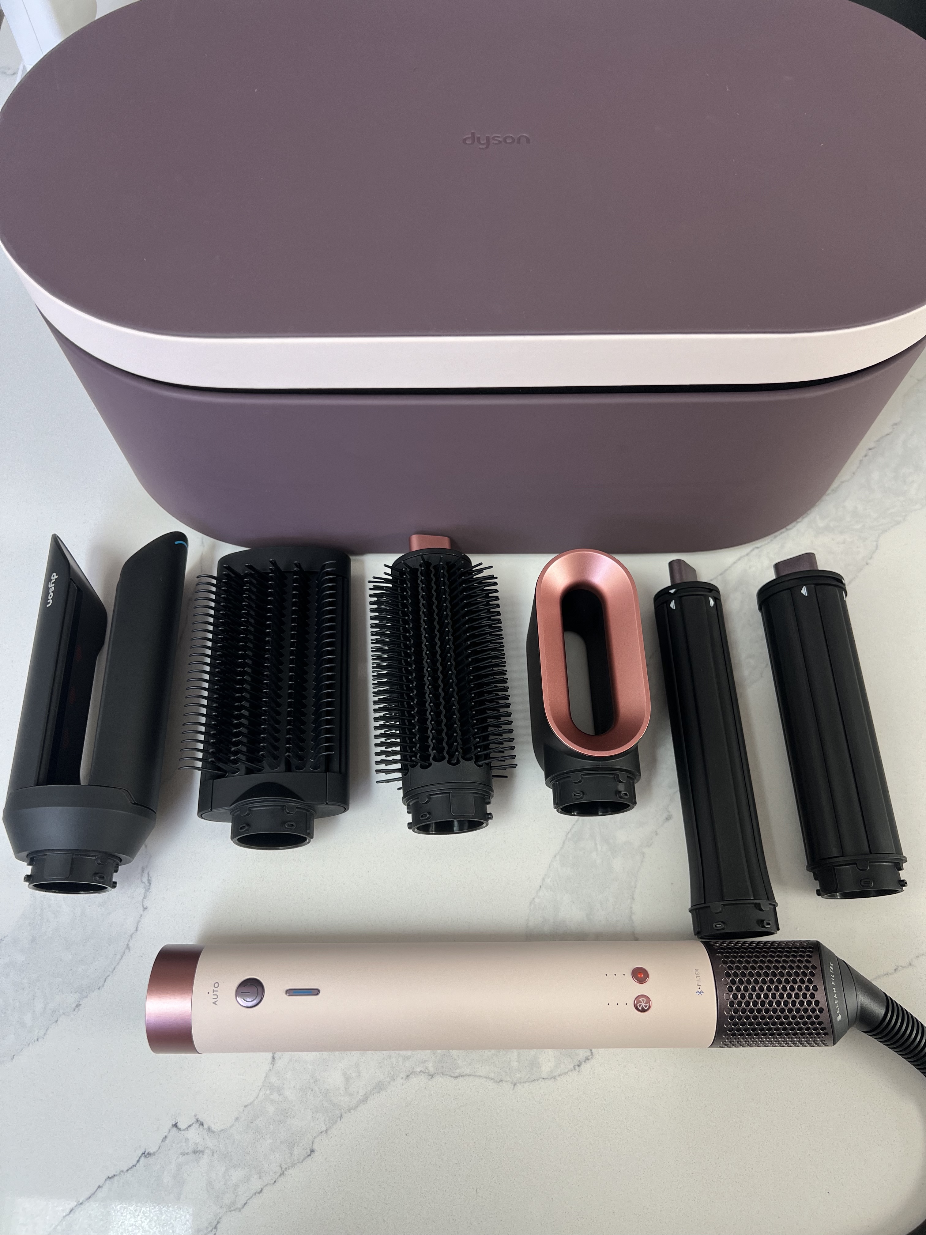 pink and purple dyson airwrap and attachments