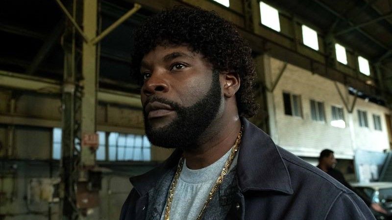 Amin Joseph as Jerome Saint standing in a warehouse in Snowfall season 6