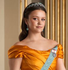 Princess Isabella wearing a gold gown and tiara on her 18th birthday