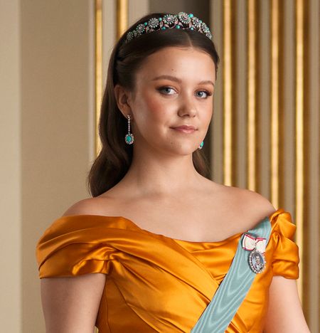 Princess Isabella wearing a gold gown and tiara on her 18th birthday