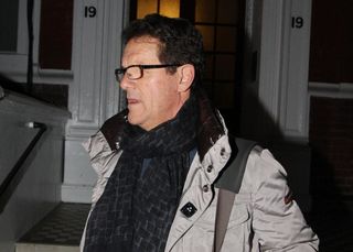 Fabio Capello leaves his central London home following his resignation as England manager