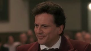 A close up of Joe Pesci smirking in My Cousin Vinny