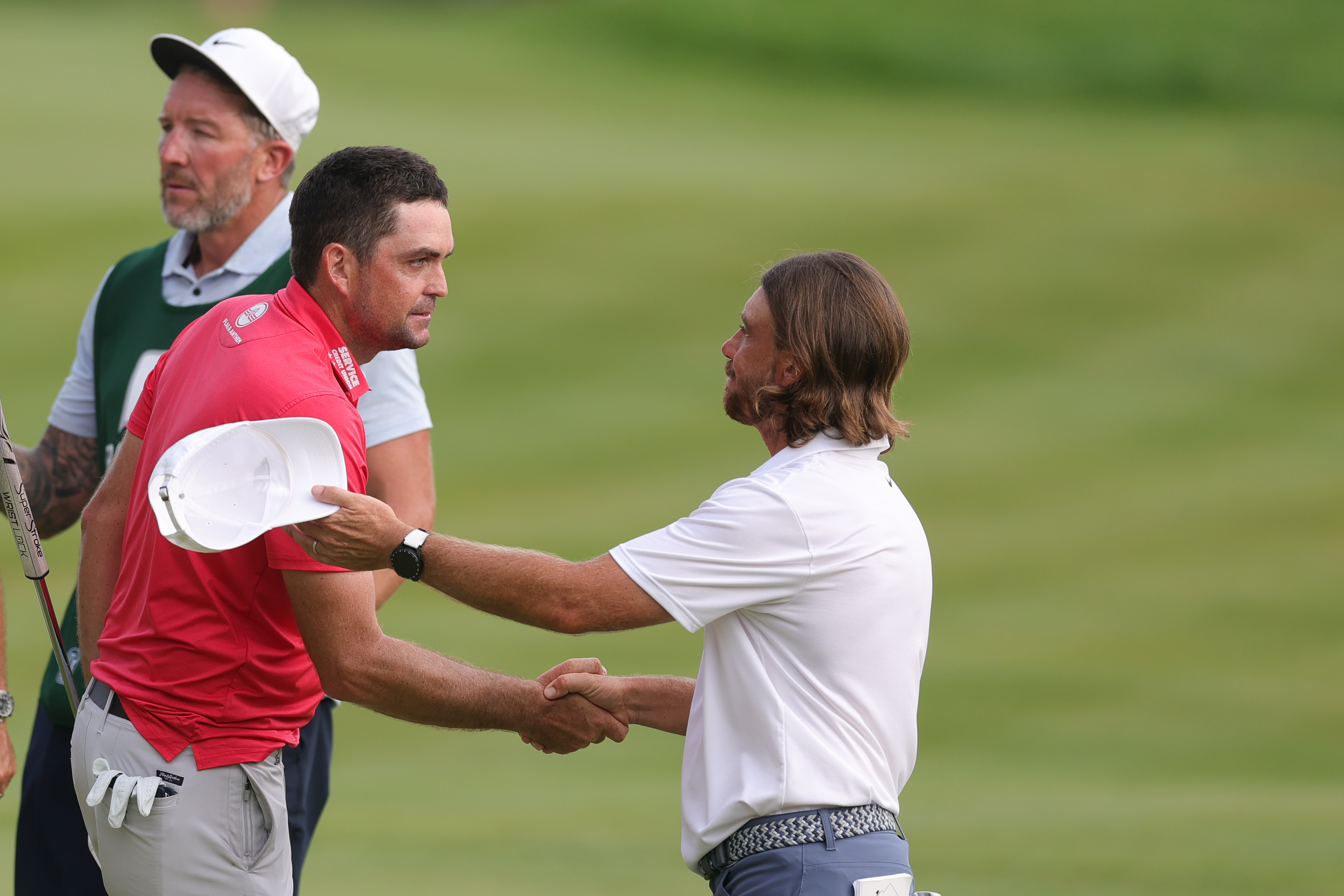 Keegan Bradley and Tommy Fleetwood shake hands