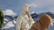 Men in Extreme Cashmere knitwear and balaclavas on snowy slopes of St Moritz