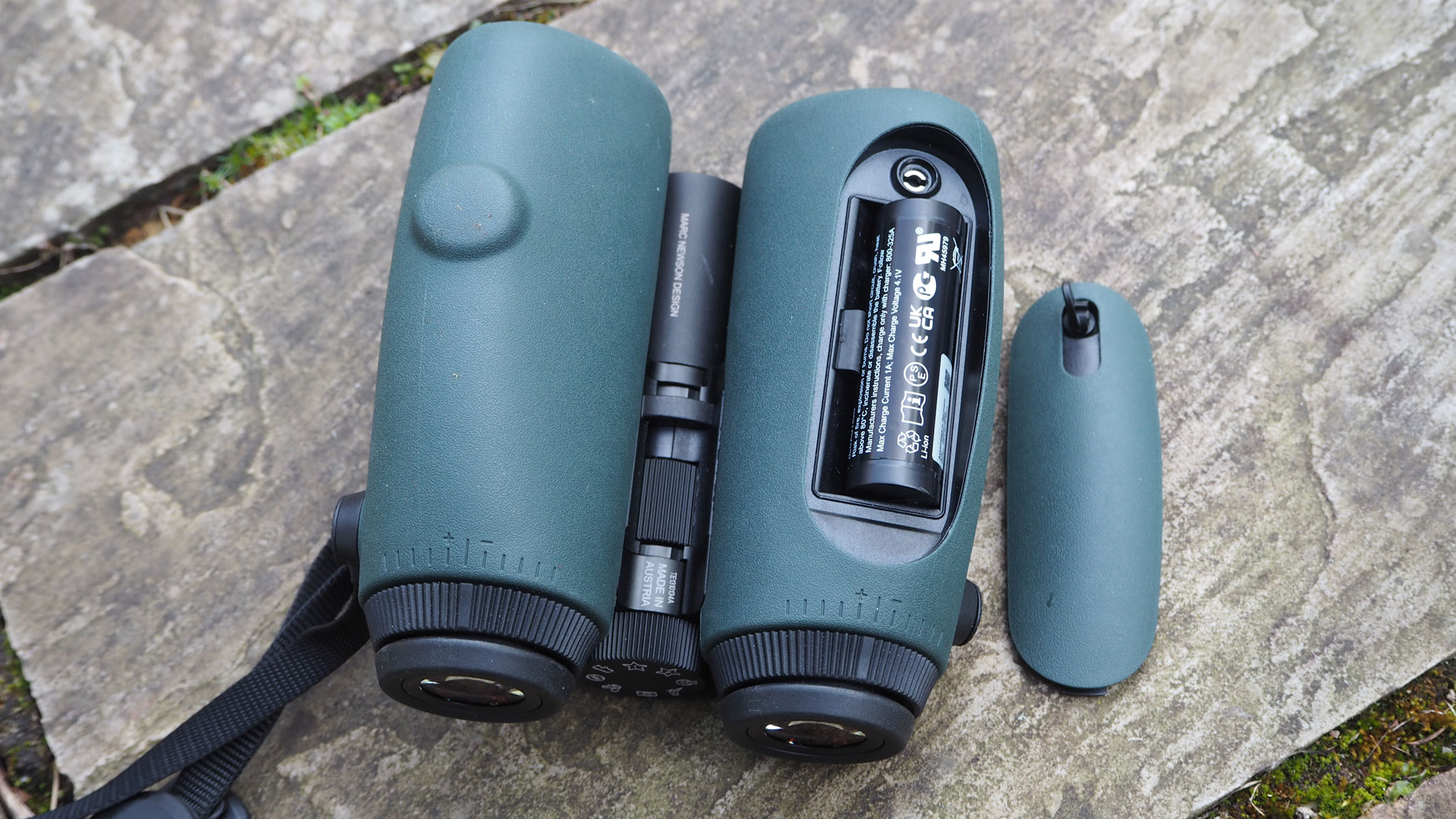 Swarovski AX Visio with the battery compartment unfastened and showing battery inside.