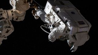 NASA astronaut Josh Cassada appears upside-down in this photo during a spacewalk on Dec. 22, 2022.