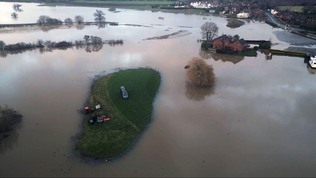 A field and houses flooded in Worcestershire