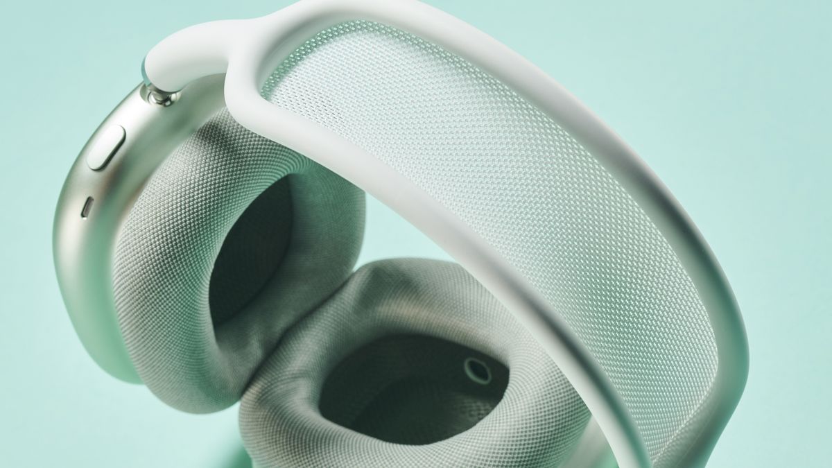 AirPods Max in green, shown from above, looking past the mesh headband to the earcups