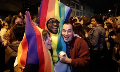 Revelers dressed in rainbow costumes celebrate the success of Washington state's referendum legalizing gay marriage.