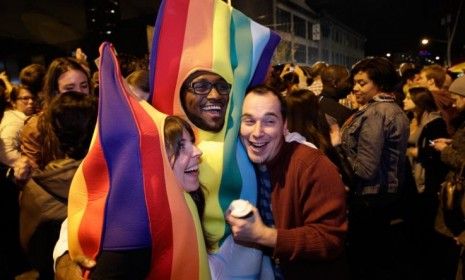 Revelers dressed in rainbow costumes celebrate the success of Washington state&amp;#039;s referendum legalizing gay marriage.