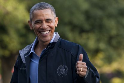 Obama gives a thumbs up.