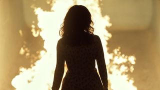 Sofía Vergara as Griselda standing in front of fire in Griselda episode 4