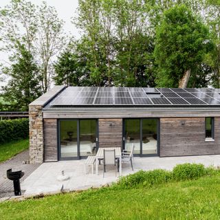 detached house with solar panels on the roof