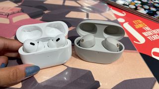 Sony WF-1000XM5 and Apple AirPods Pro 2 placed next to each other against a colourful background