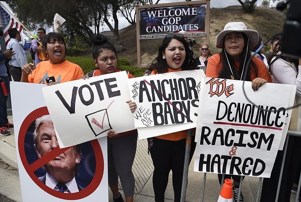 Advocates for immigration rights protest Donald Trump.