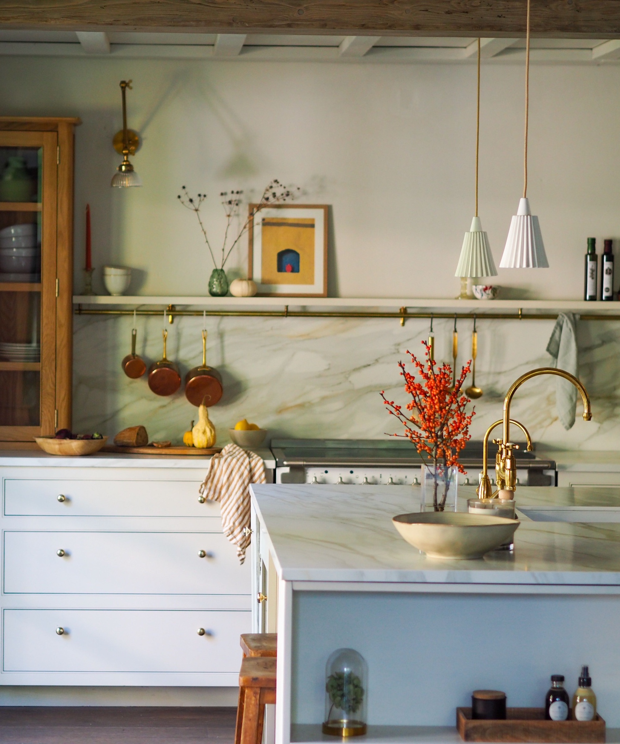 white kitchen with marble look backsplash