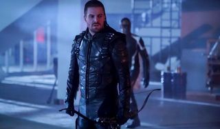 Arrow Stephen Amell looks angry with crossbow in hand