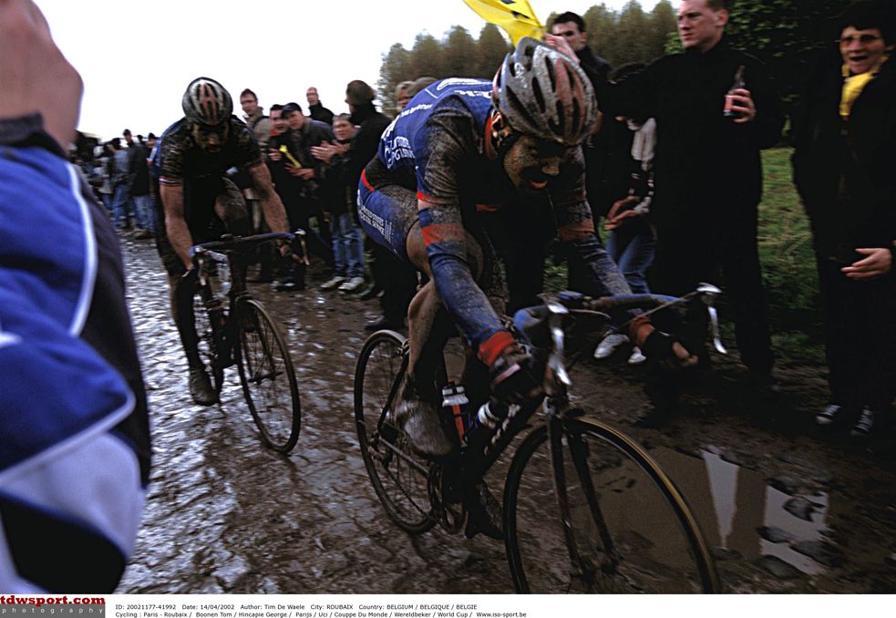 Tom Boonen and George Hincapie for U.S. Postal on the pave during a wet Paris-Roubaix, 2002