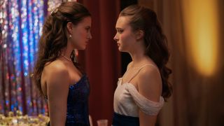 Fina Strazza and India Fowler stand looking at each other with concern in Fear Street: Prom Queen.