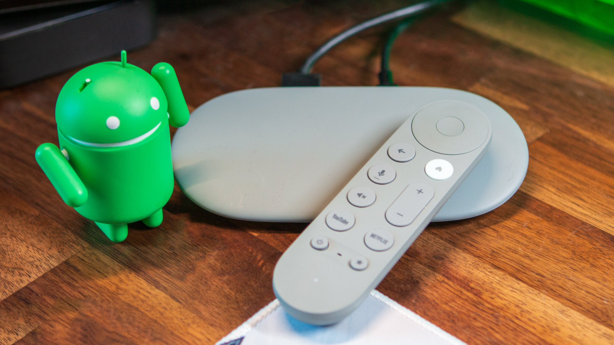 Google TV Streamer with Android figure and remote