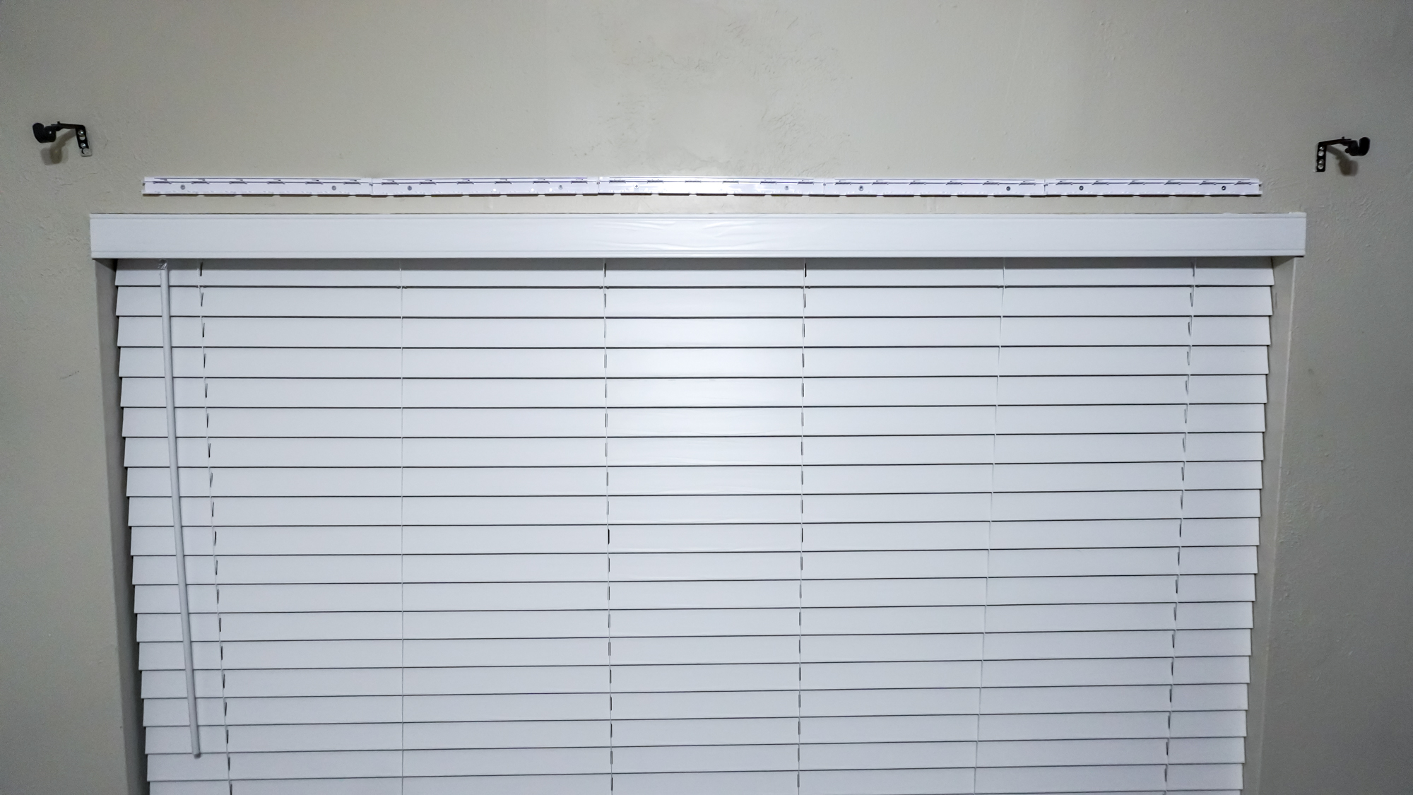 Installing the Govee Curtain Lights Pro using the included mounting bar