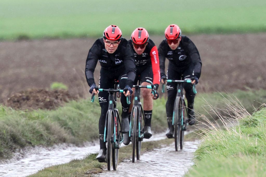 Team Arkea - B&amp;B Hotels riders cycle on the paved sector during a reconnaissance ride for the 121st edition of the Paris-Roubaix upcoming cycling event in Haveluy on April 5, 2024. (Photo by FRANCOIS LO PRESTI / AFP)