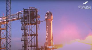 Blue Origin's suborbital New Shepard vehicle fires up to launch William Shatner, Chris Boshuizen, Glen de Vries and Audrey Powers to the final frontier on Oct. 13, 2021.