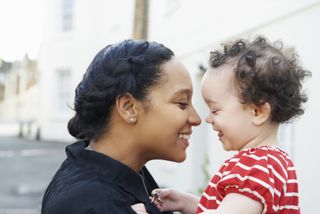 Perinatal mental health: mother holding happy child