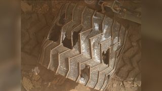 a rover wheel with holes among some of the treads