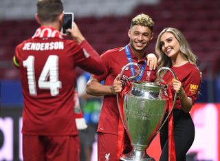 Little Mix's Perrie Edward poses with her boyfriend Liverpool footballer Alex Chamberlain