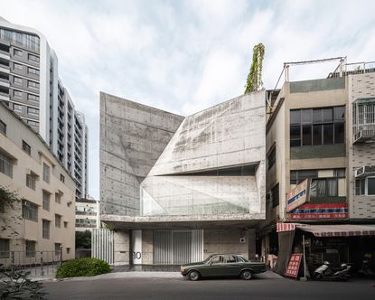 Star house with its angular concrete facade as seen from the street