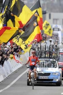 The Belgian flags dwarfed the tiny Swiss flag held by Cancellara.