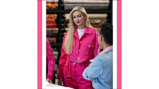 Host Gigi Hadid wears a pink denim jacket and jeans in episode 105 of Next in Fashion